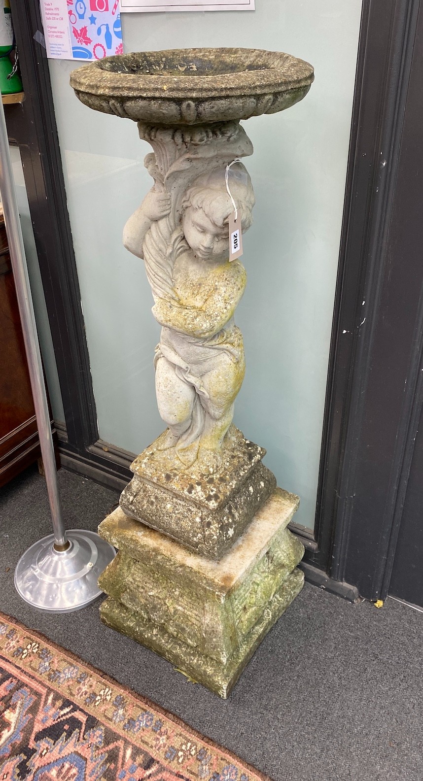 A reconstituted stone figural bird bath, height 119cm